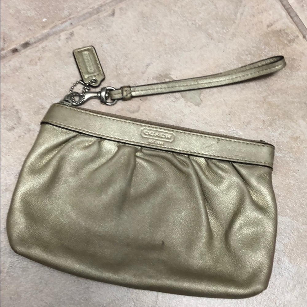Gold coach wristlet